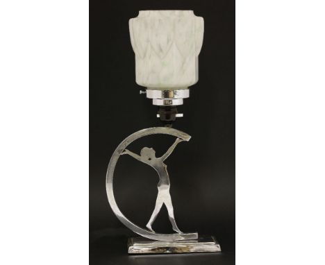 An Art Deco chrome table lamp,modelled as a nude holding a 'C' shaped disc, with a mottled glass shade