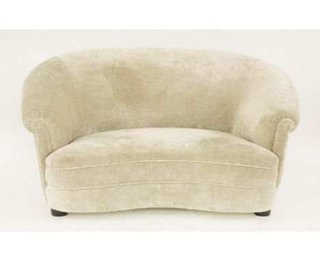 A two-seater curved sofa,British, c.1940, upholstered in Matthew Williamson for Osborne & Little 'Salsa' velvet,151cm wide87.