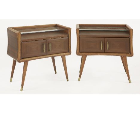 A pair of Italian mahogany bedside tables,with a glass shelf over a cupboard, on strut legs,63.5cm wide34cm deep60.5cm high (