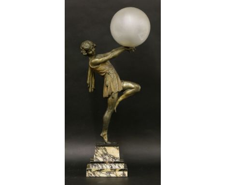 An Art Deco lamp,the spelter female dancer holding a glass globe, on a stepped marble base,65cm high