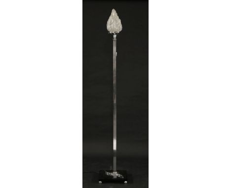 An Art Deco chrome-style standard lamp,with a moulded flaming torch shade, on an ebonised plinth,178cm high