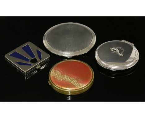 A sterling silver circular hinged powder compact,designed by Harald Nielsen for Georg Jensen, No. 231N, with an applied dolph