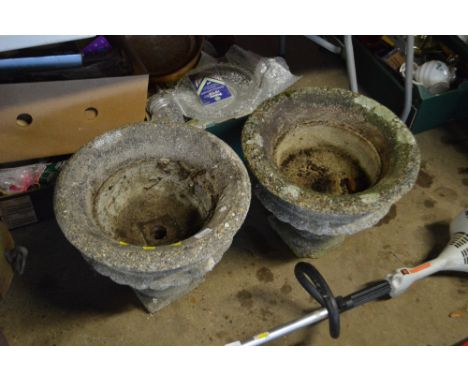 A pair of concrete garden planters 