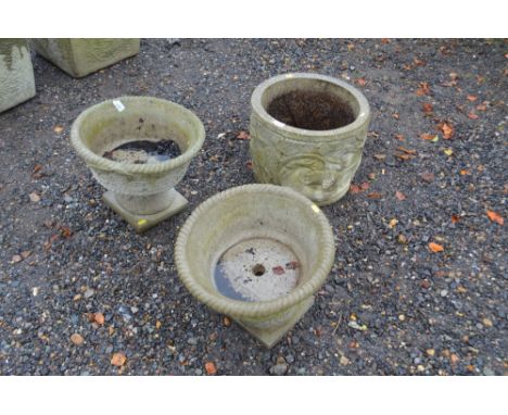 Three concrete garden planters