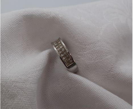 Gemporia - A platinum dress ring, set with two rows of princess cut diamonds