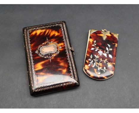A tortoiseshell note case of rectangular form, inlaid with yellow metal and mother of pearl, the silk interior with compartme