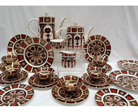 A Royal Crown Derby 1128 Imari pattern part tea set, comprising a hot water pot, teapot, cream jug, sugar basin, spoon, six t