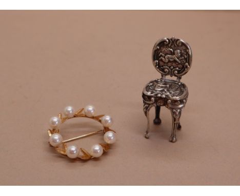 A 14k yellow gold pearl set brooch of circular form together with a miniature silver chair