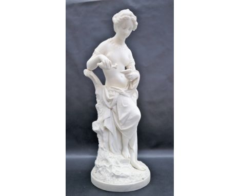 A Minton parian figure of Psyche after A.E. Carrier-Belleuse: pouring oil into a lamp, with tree stump support and on circula