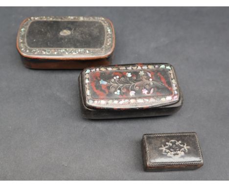 A 19th century papier mache mother of pearl inlaid snuff box,  together with two other papier mache snuff boxes