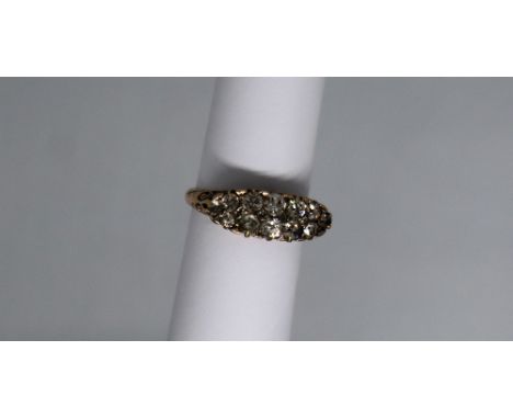 A diamond cluster ring set with two rows of old round cut diamonds to a white metal setting and yellow metal shank, size Q, a