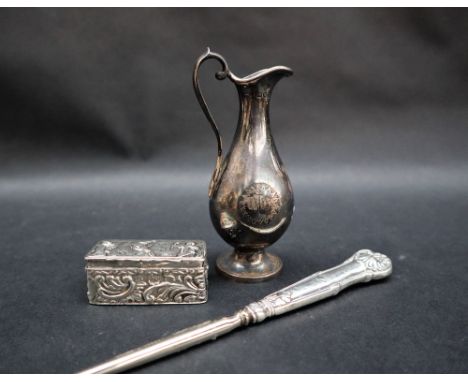 A late Victorian miniature silver ecclesiastical ewer, on a spreading foot, engraved with a christogram, London, 1890, 10cm h