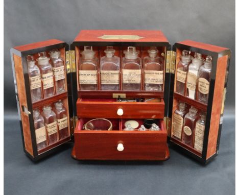 A 19th century mahogany apothecary cabinet, of rectangular form with a brass folding carrying handle and a pair of brass hing