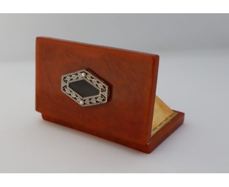 An Art Deco French 18ct gold diamond and pearl set bakelite powder compact, the interior with a rectangular bevelled mirror, 