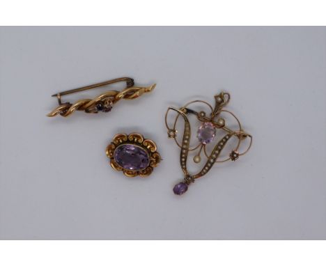 A 15ct gold bar brooch, of rope twist form set with a diamond, ruby and sapphire approximately 2 grams together with a 9ct go