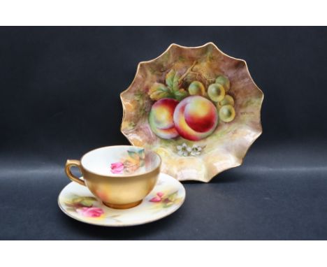 A Royal Worcester cabinet cup and saucer painted with a pink rose and rose buds, signed M Hunt together with  another fine bo