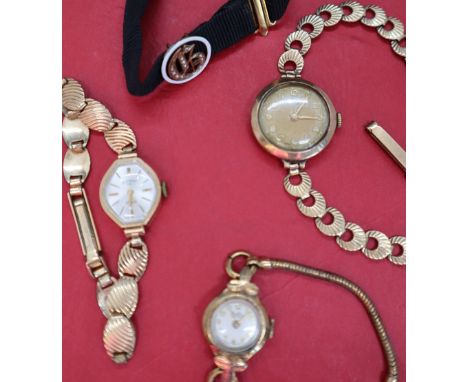 A lady's Timor 9ct gold wristwatch with a circular dial and Arabic numerals on a 9ct gold strap, together with another 9ct go