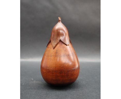 Treen - a caddy in the shape of a pear, the leaf top unscrewing to a vacant interior, 11.5cm high 