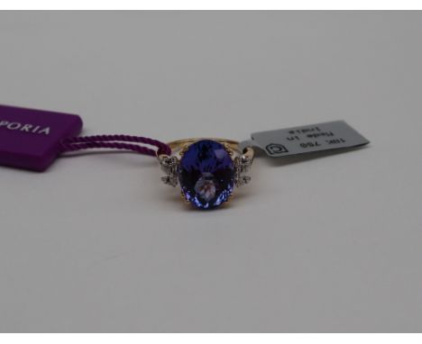 Gemporia - A tanzanite and diamond 18k gold Lorique ring, set with a 7ct oval tanzanite and twenty diamonds, size n to O, met