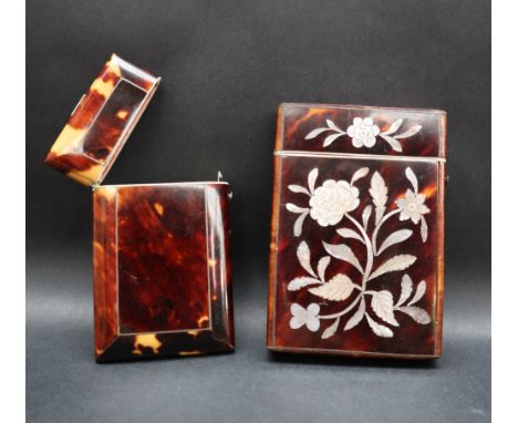 A Victorian tortoiseshell card case, inlaid with mother of pearl flowers and leaves 95mm high together with another tortoises