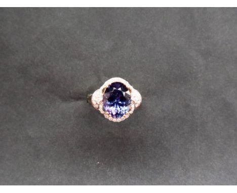Gemporia - A 7.9cts oval tanzanite and diamond 18k gold Lorique ring, size N to O, metal 5.13g with certificate