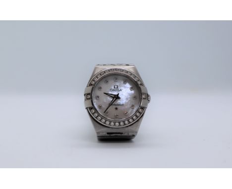 A lady's Omega Constellation wristwatch, with a mother of pearl dial and diamond dot markers to a diamond set bezel on a segm