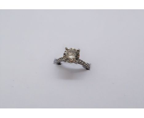 A solitaire diamond ring, the round brilliant cut diamond approximately 2ct,with diamond set shoulders to a platinum setting 