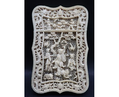 A 19th century Chinese Canton ivory visiting card case, with an arched top, and pierced decoration of figures, trees and anim