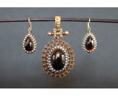 A Victorian yellow metal and seed pearl and paste set pendant with matching earrings, approximately 44 grams