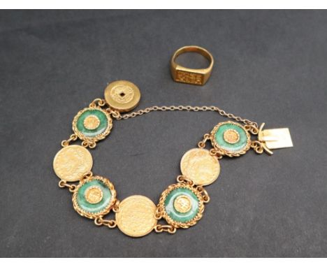 A Chinese yellow metal coin and jade set bracelet, with chain attachments, marked 22 together with a Chinese yellow metal sea