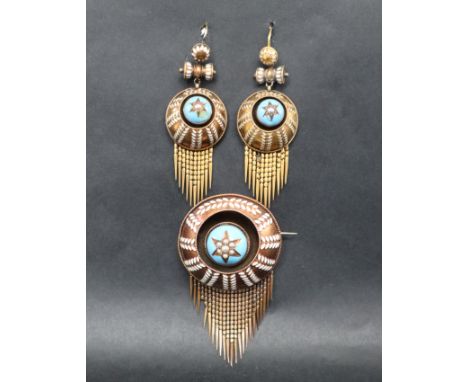 A Victorian yellow metal, turquoise and white enamel, seed pearl decorated brooch of circular form with fringe, with matching