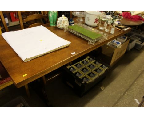 An oak refectory style dining table with a set of six ladder back chairs