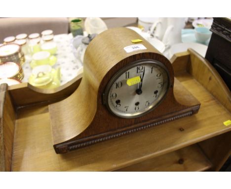 A German oak cased three hole mantel clock