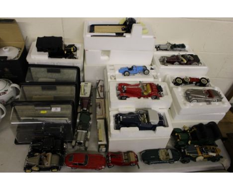 A large quantity of boxed and unboxed Franklin Mint and other model vehicles including sports cars, vintage flatbed lorry etc