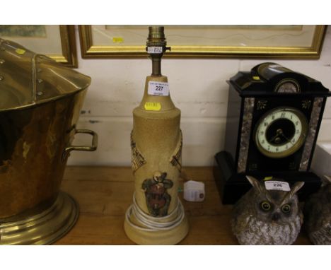 A Bernard Rooke pottery table lamp with music decoration