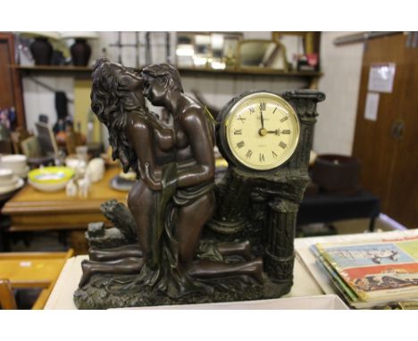 A modern bronze effect mantel clock