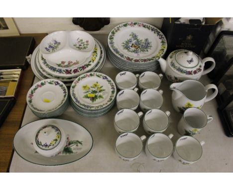 A quantity of Royal Worcester herb decorated tea and dinnerware