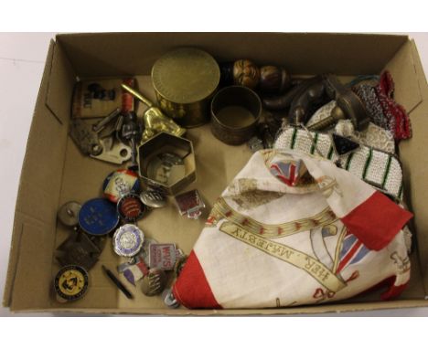A box containing various decorative enamel badges; a beadwork purse; a Royal Commemorative scarf etc.