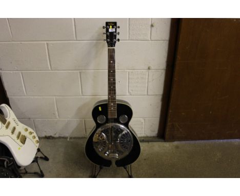 A Resonator vintage guitar on stand
