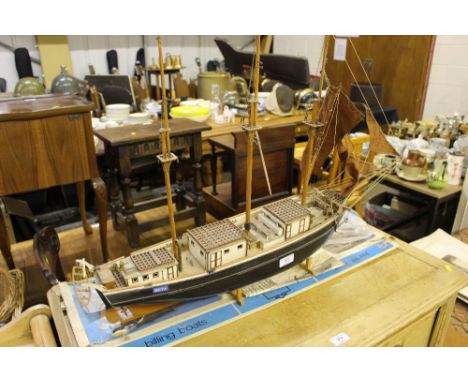An unfinished wooden model boat