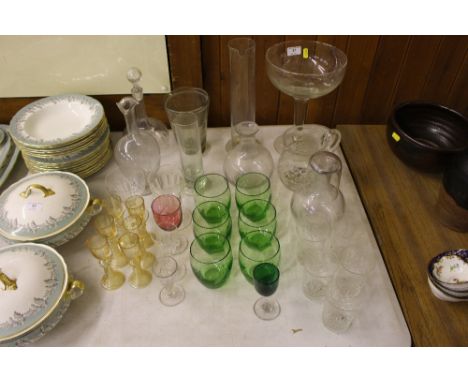 A quantity of various decorative glassware including a large champagne saucer, two rummers, decanters, carafes, table glasses