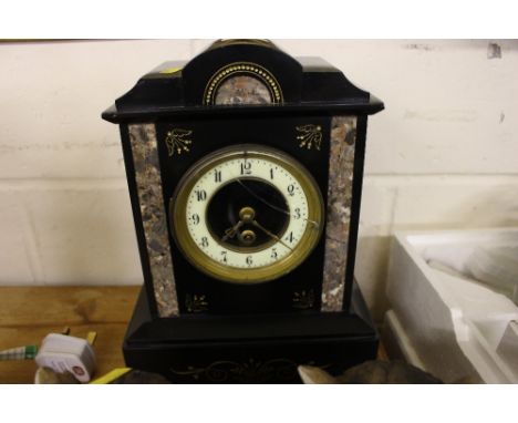 A black slate and marble single hole mantel clock