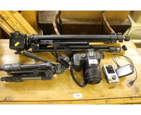 A Panasonic camera; a digital camera; two tripods etc.