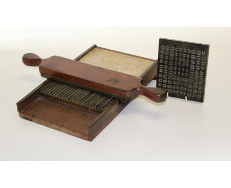 A 19th century chemist's mahogany, brass and marble pill roller/ cutter, together with a bronze dentists/ orthodontist's crow