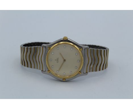 An 18ct and stainless steel Ebel gentleman's wristwatch. Diamond intervals, champagne dial to a quartz movement, 32mm dial, l