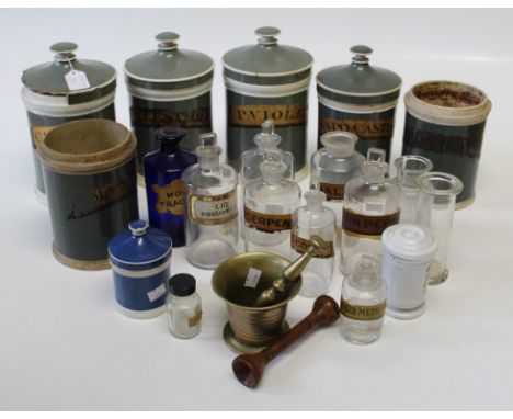 Six 19th century stoneware chemist's/ drug jars, variously labelled, two without covers, together with eleven glass drug jars