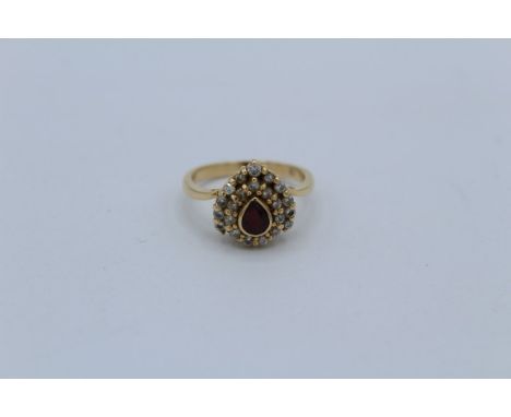 A ruby and diamond pear shaped design dress ring in precious yellow metal, stamped 18k and 750. Size L, gross weight&nbsp;app