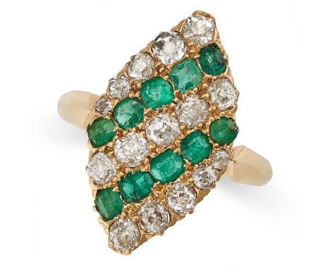 AN EMERALD AND DIAMOND NAVETTE RING in yellow gold, the navette face set with alternating rows of cushion cut emeralds and ol