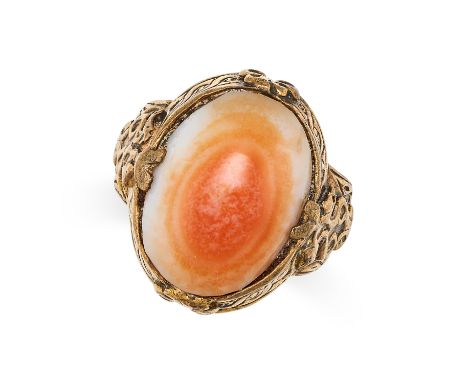 AN ANTIQUE AGATE DRESS RING set with a cabochon cut agate to scrolled detailed setting and shoulders, no assay marks, size Q1