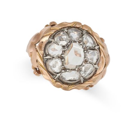 AN ANTIQUE DIAMOND CLUSTER RING in yellow gold, set with a cluster of rose cut diamonds, to an scroll setting, indistinct ass